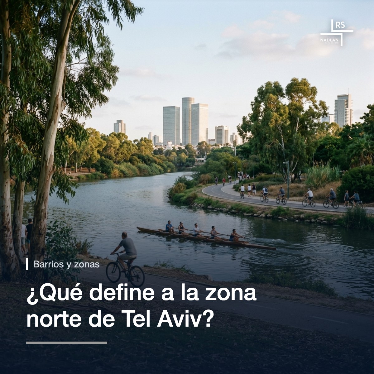 El parque HaYarkon al final de la tarde: el río con un bote de remos, ciclistas en el sendero, césped y eucaliptos