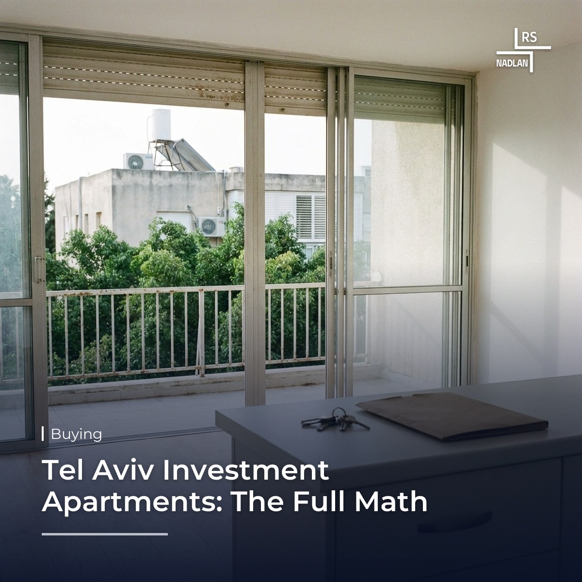 Bright apartment ready for rental in an older Ramat Aviv building, with keys on the kitchen counter and a balcony overlooking ficus trees