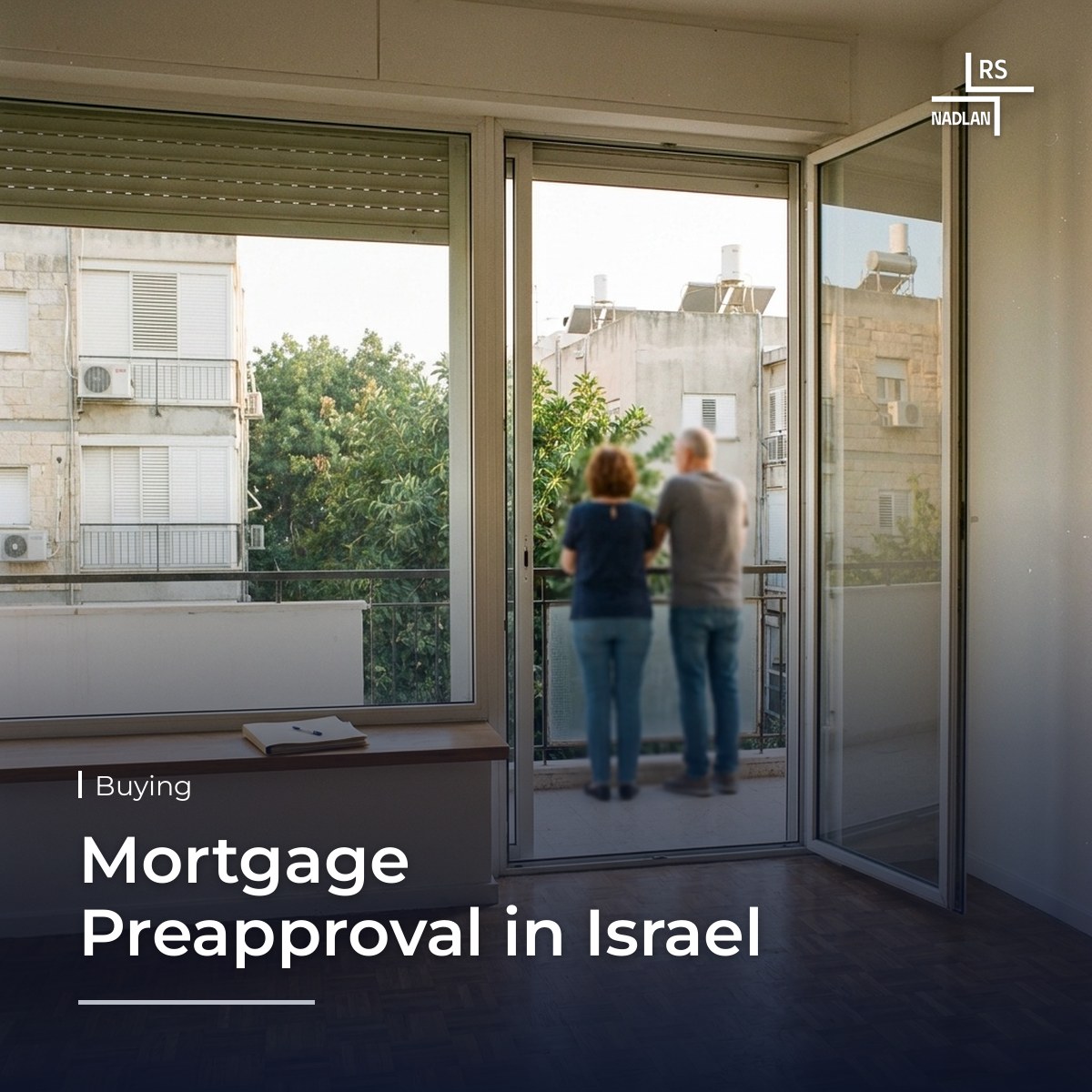 Empty sunlit living room in an apartment for sale in north Tel Aviv with a folder of bank documents on the window sill