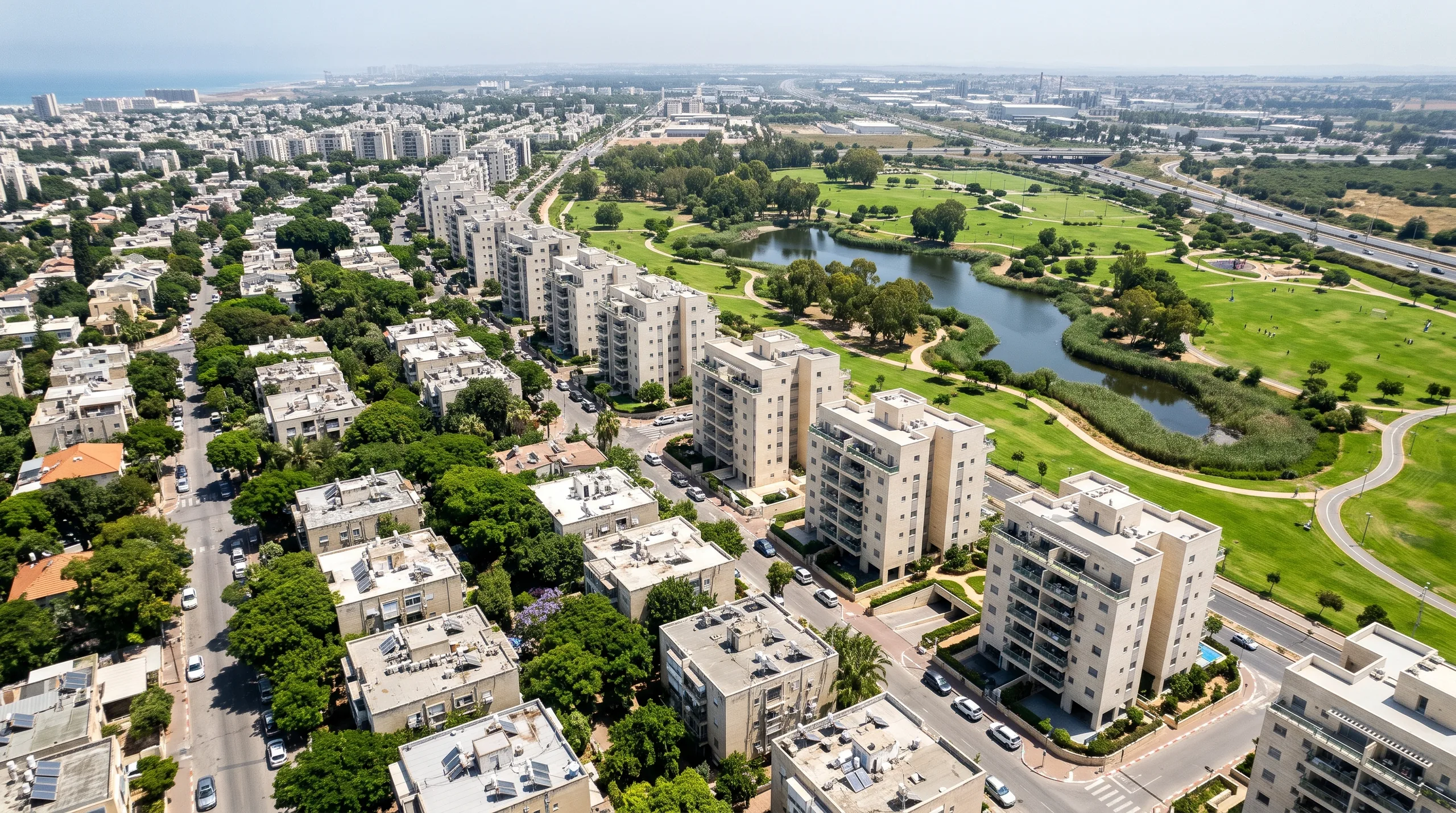 Real estate agency in Herzliya HaYeruka: an aerial view over the neighborhood, the buildings of Western HaYeruka and Herzliya Park (illustration)
